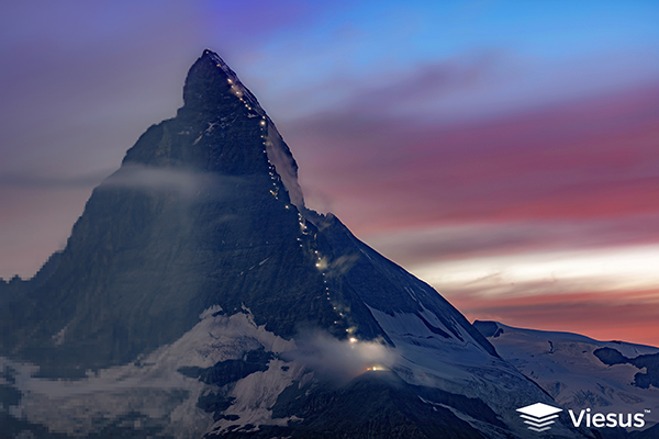 This is the original input image, a Matterhorn photo during sunrise, going from pixelated and enhanced to sharp and enhanced after being processed by Viesus.